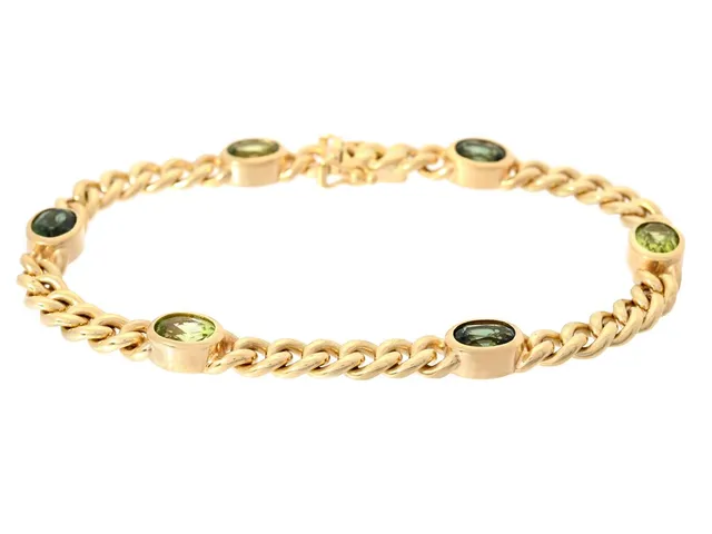 ARMBAND, 18K guld, pansarlänk, ovalslipade gröna turmaliner och peridoter, Italien, längd 19 cm, vikt 25,5 g.