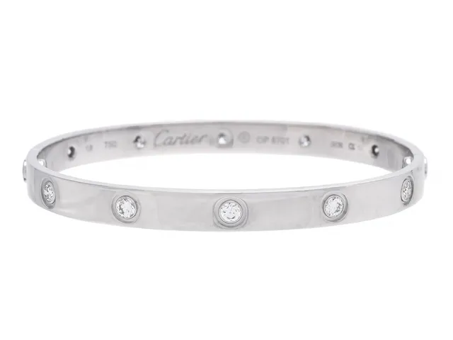CARTIER, armband, Love bracelet, 18K vitguld, 10 briljantslipade diamanter, ref. nr OP5701, stl 18, vikt 31 g, skruvmejsel, originaletui