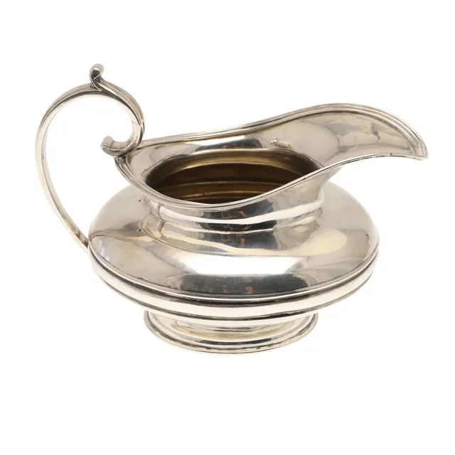 A WILLIAM IV SILVER MILK JUG.