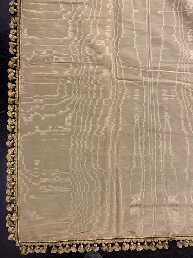 Pair of green silk "moiré" draperies, early decades of the 20th Century.