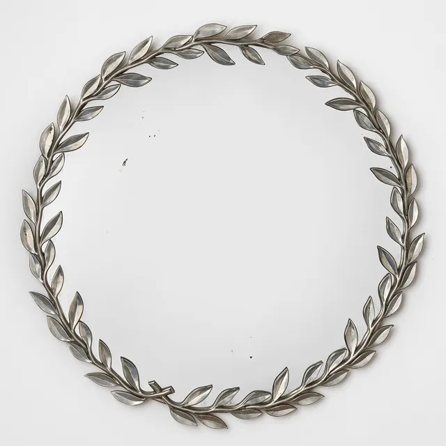 ESTRID ERICSON. "Lagerbladsspegeln", Firma Svenskt Tenn, Stockholm 1940-tal, modell 2492, rund form med ram i tenn i form av lagerkrans.