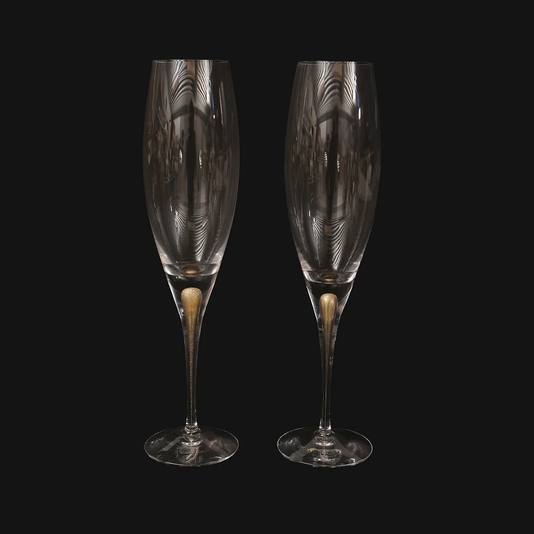 ERIKA LAGERBIELKE. Champagneglas "Intermezzo Guld" Orrefors, 2 stycken. — Tableware — Limhamns Auktionsbyrå