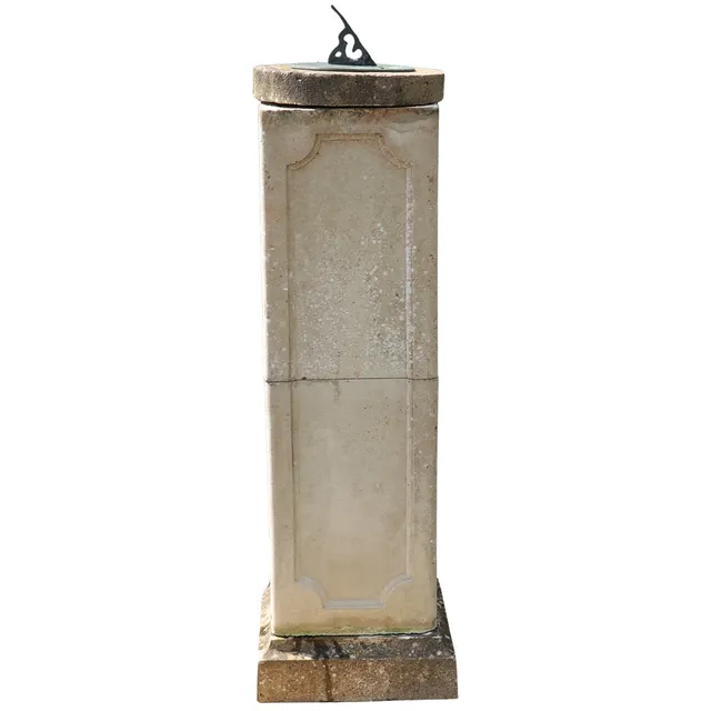 A LARGE RECONSTITUTED STONE COLUMN.
