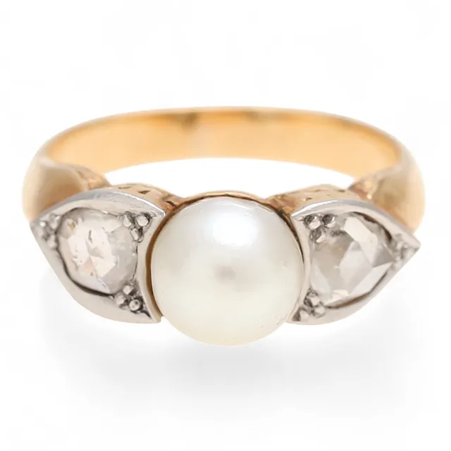 Triplet diamonds and pearl ring, circa 1940.