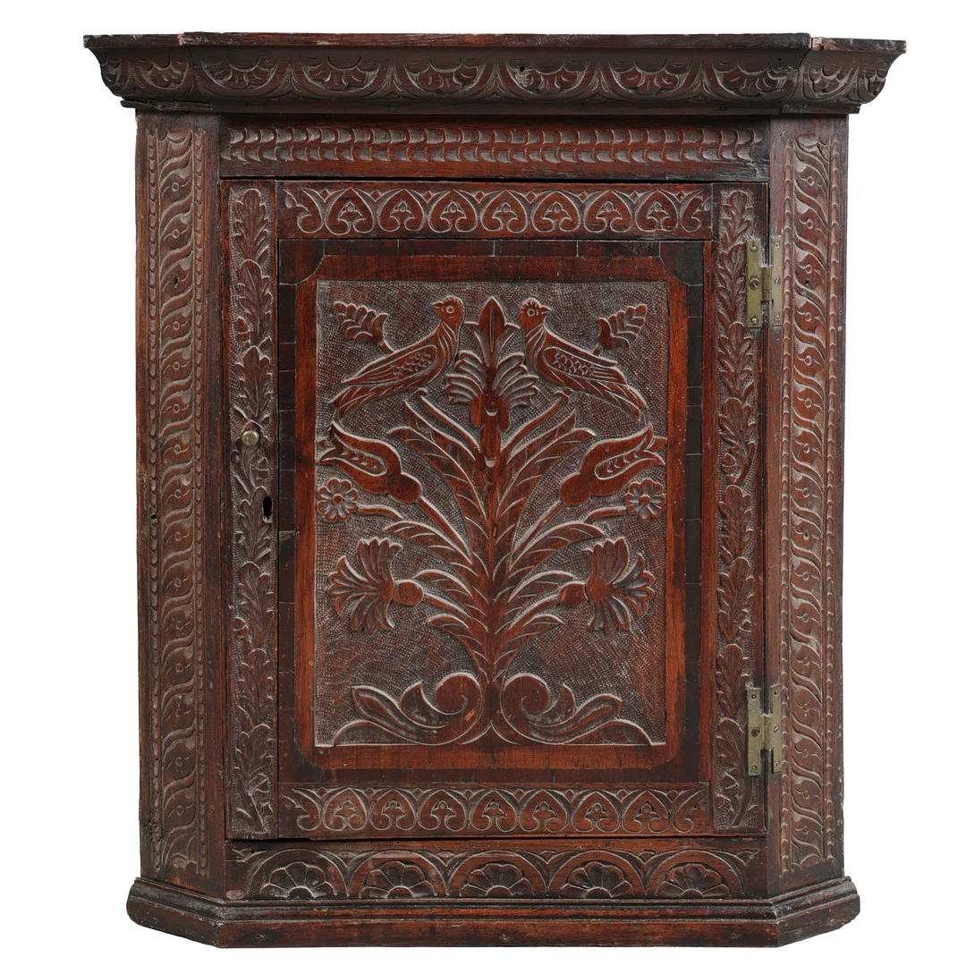 AN 18TH CENTURY OAK CARVED HANGING CORNER CUPBOARD. — Cupboards, Cabinets & Shelves — Bishop & Miller