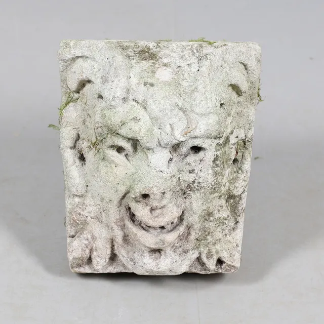 A MEDIEVAL CARVED STONE CORBEL.