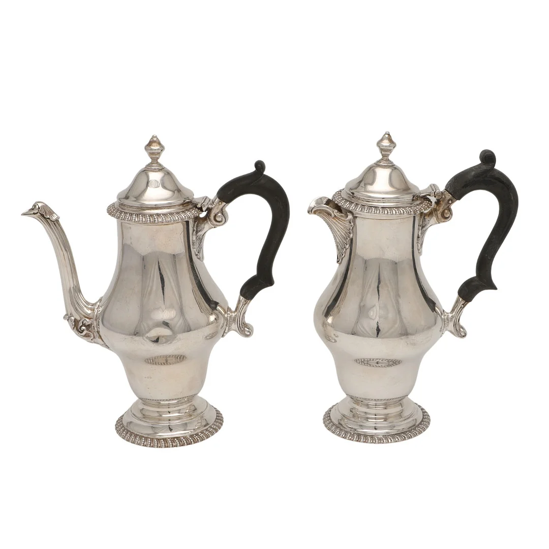 A PAIR OF GEORGE V SILVER CAFE AU LAIT POTS. — Silver — Lawrences Auctioneers