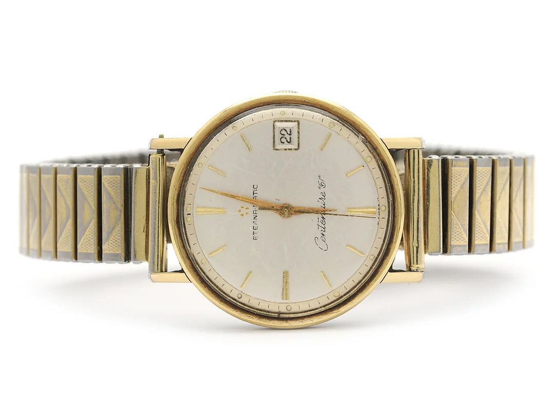 ETERNA-MATIC, Centenaire "61", Boett nr. 4832792, herrur, 34,5 mm, guld på stål, automatisk, plexiglas, datum, skadad urtavla, ca 1961, metallänk ej original. — Klockor/Eterna — Kaplans