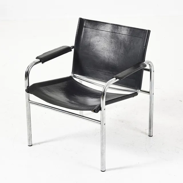 TORD BJÖRKLUND. Modell "Klinte", karmstol, IKEA, 1980-tal, kromad stålrörs stomme.