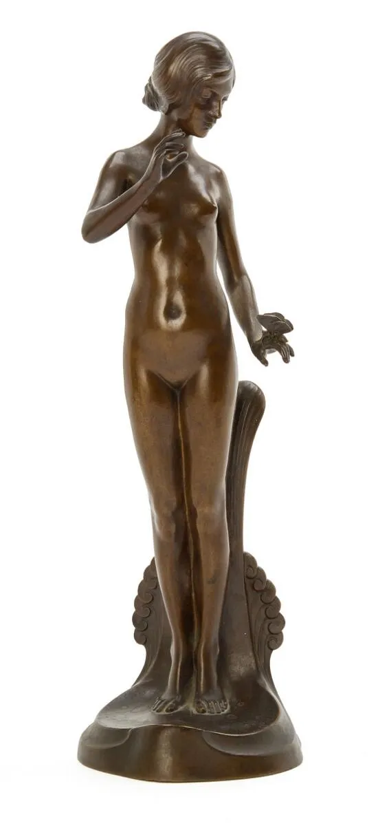 A Woman with a Butterfly. Signed Dahl Jensen 1906, stamped L. Rasmussen, København. Sculpture in patinated bronze. H. 29 cm.