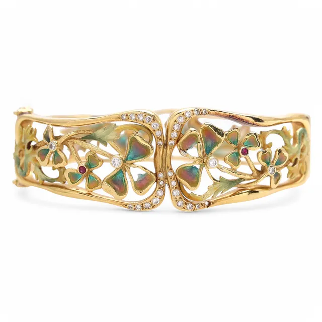 Gold and diamond bangle bracelet with enamelled floral decoration.