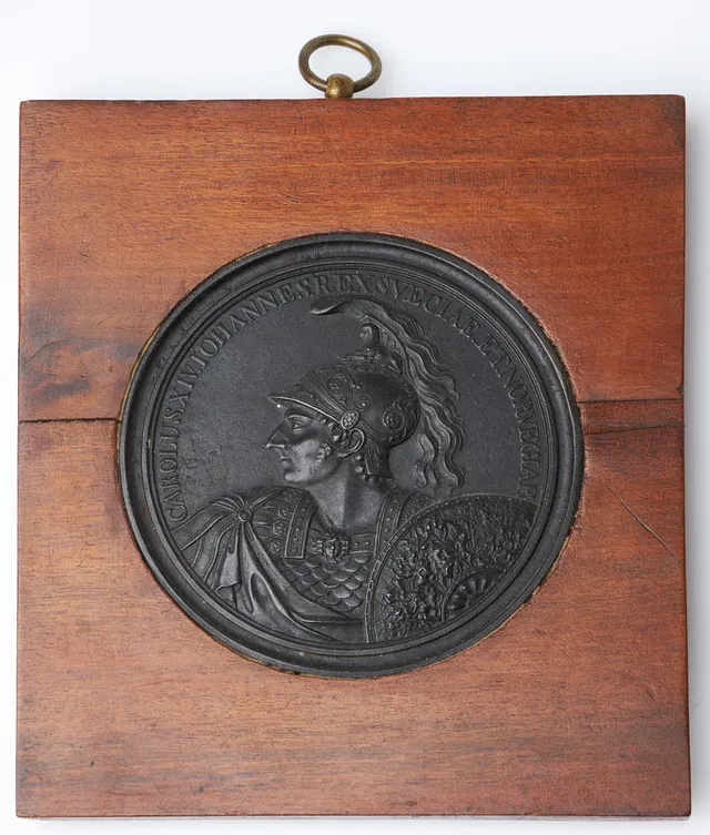 PLAKETT, 1800-tal, Karl XIV Johan, patinerad gjutjärn, monterad i träram.