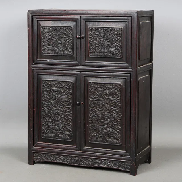 A CHINESE HARDWOOD CARVED CUPBOARD, 20TH CENTURY.