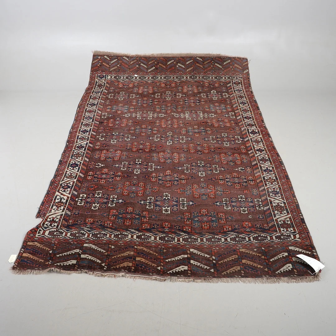 A LATE 19TH/EARLY 20TH CENTURY YOMUT MAIN CARPET. — Carpets — Lawrences Auctioneers