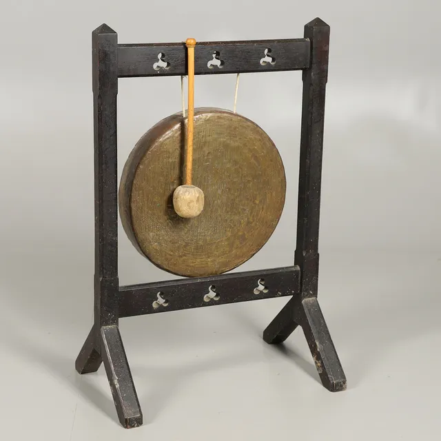 AN OAK GONG STAND AND GONG.