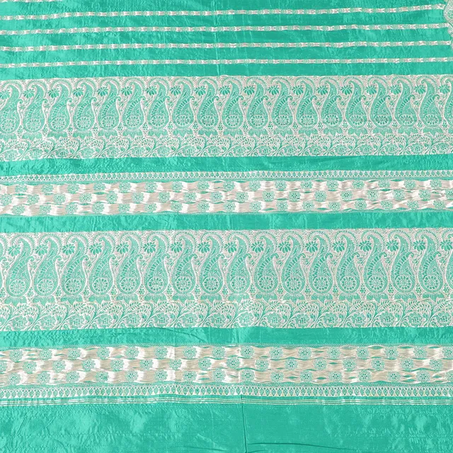 A LENGTH OF EMERALD GREEN SARI SILK.
