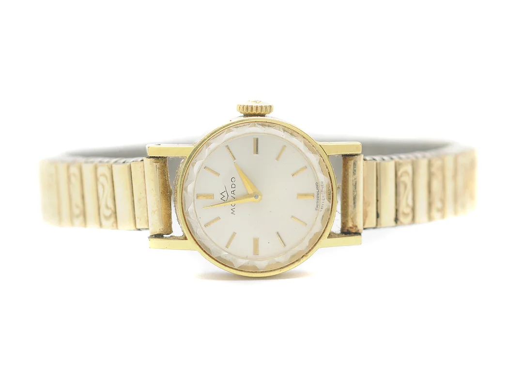 MOVADO, damur, 17,5 mm, doublé (20 micron), manuell, plexiglas, skadad urtavla, ca 1965, metallänk ej original. — Klockor/Movado — Kaplans
