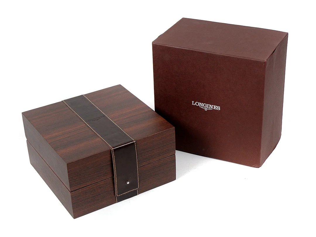 BOX, till "The Longines Lindbergh Hour Angle Watch", trä, ca 2007, ytterkartong (skadad). — Klocktillbehör/Longines — Kaplans