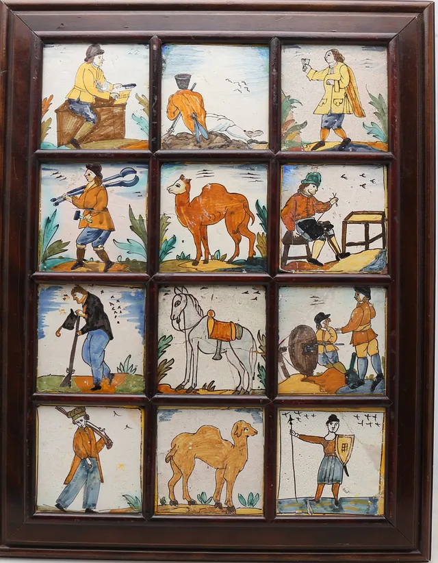 Panel of twelve Catalan "d'Arts i Oficis" tiles, 18th and 19th centuries.