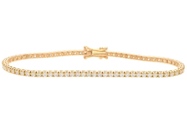 TENNISARMBAND, 18K guld, 77 briljantslipade diamanter ca 1,55 ctv, ca TW-W/VVS-VS, längd 16 cm, vikt 7,5 g.