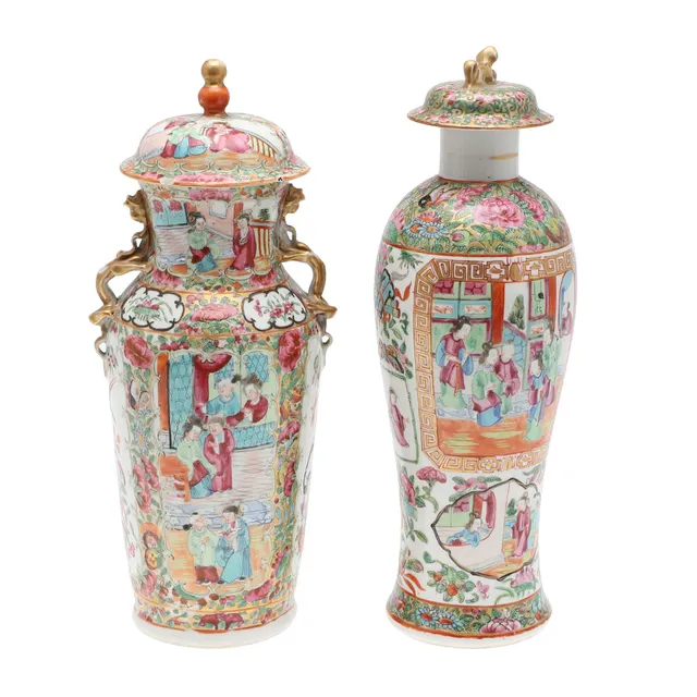 TWO CANTON FAMILLE DECORATED VASES AND COVERS.