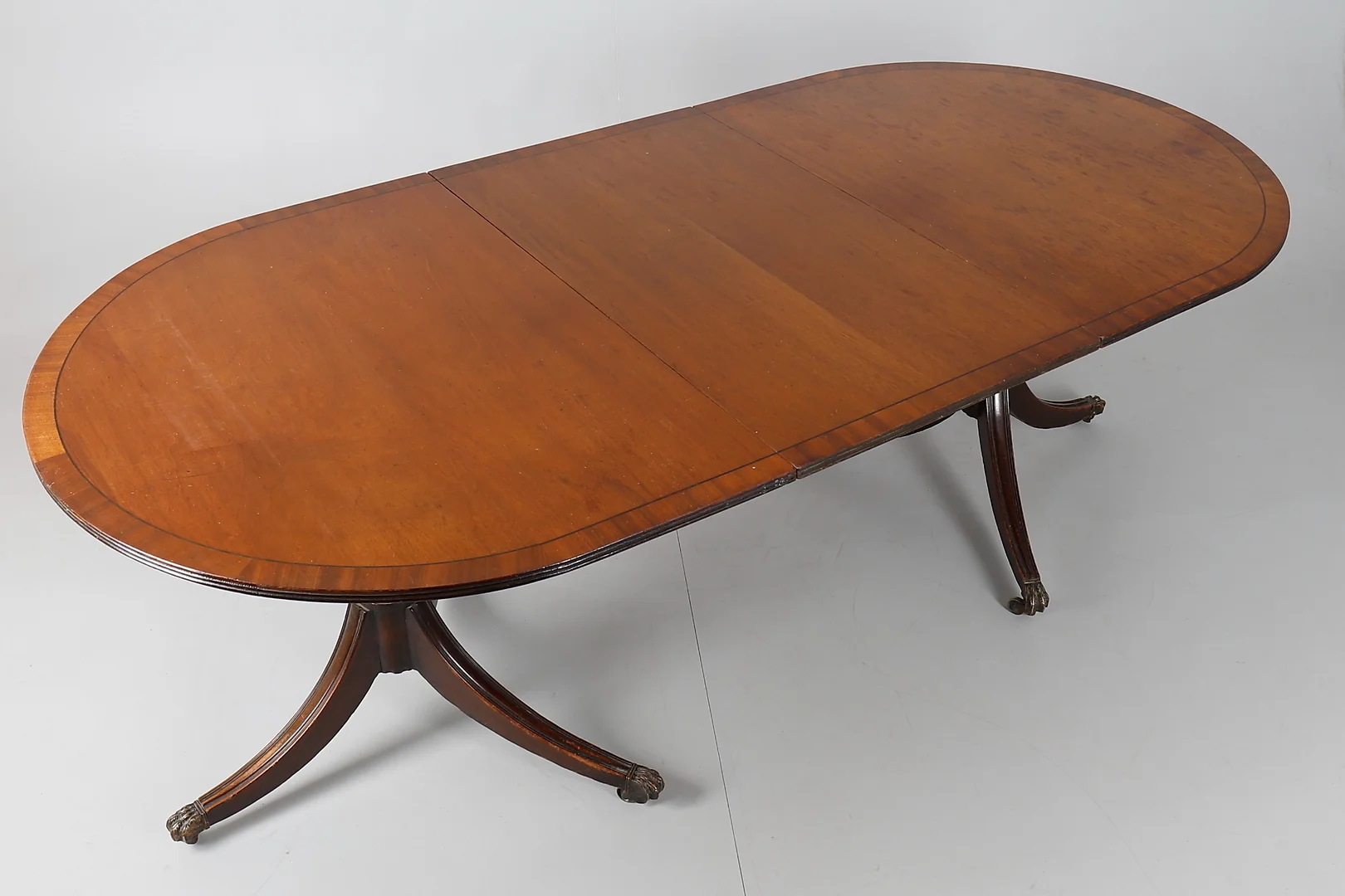 A 20TH CENTURY MAHOGANY TWIN PEDESTAL DINING TABLE. — Tables — Dreweatts Online