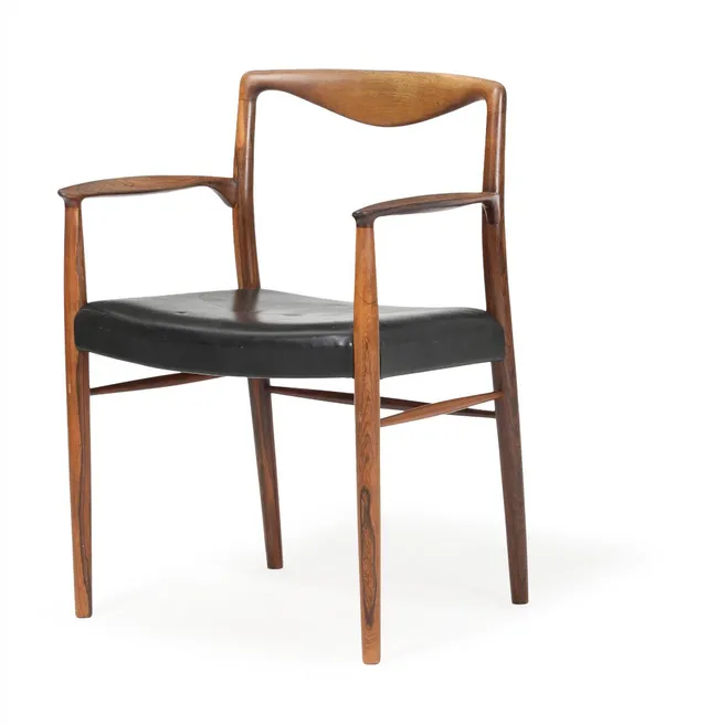 A rosewood armchair, upholstered with black leather. Manufactured and marked by Søren Willadsen, Vejen. 1960s.