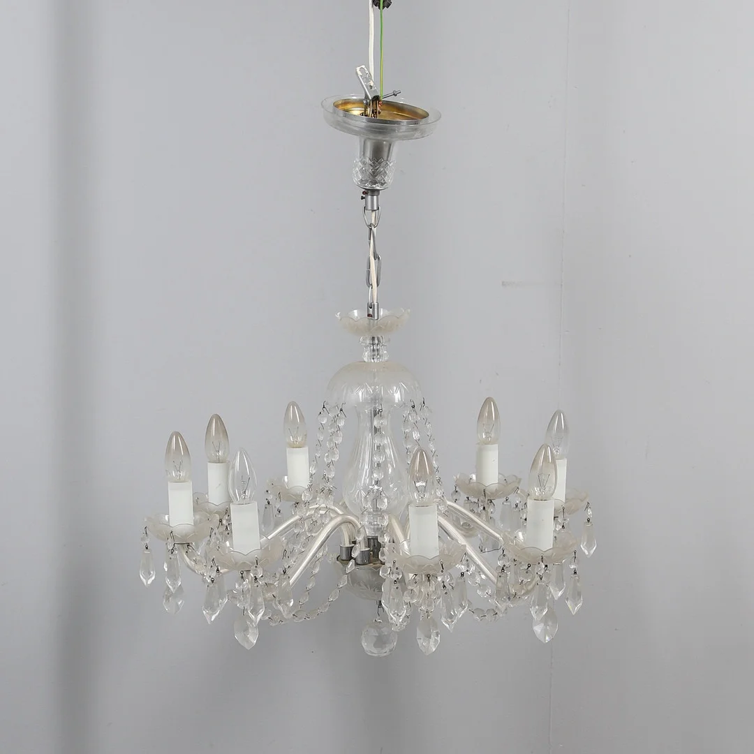 A BOHEMIAN MID CENTURY EIGHT BRANCHED CUT GLASS CHANDELIER. — Chandeliers — Lawrences Auctioneers
