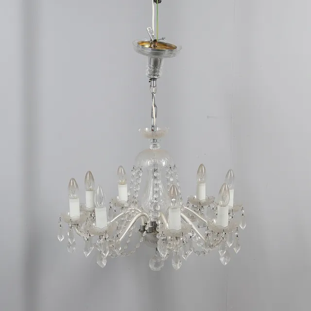 A BOHEMIAN MID CENTURY EIGHT BRANCHED CUT GLASS CHANDELIER.