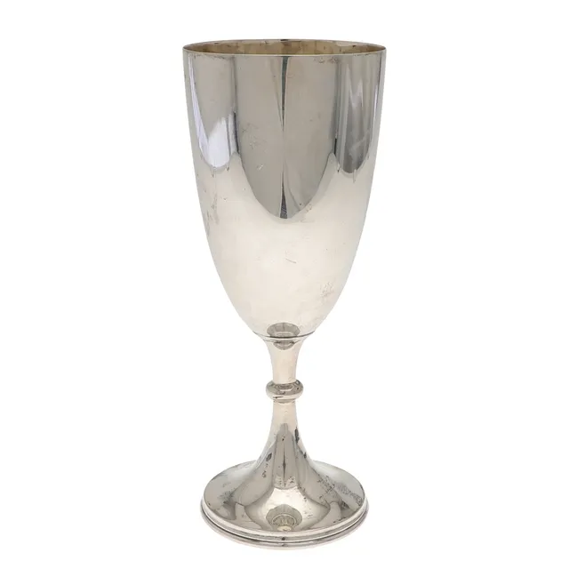 A LATE VICTORIAN SILVER CUP.