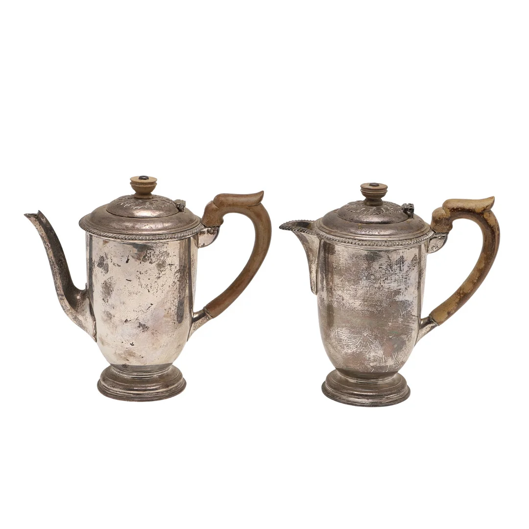 A VERY NEAR PAIR OF 20TH CENTURY SILVER CAFE AU LAIT POTS. — Silver — Lawrences Auctioneers