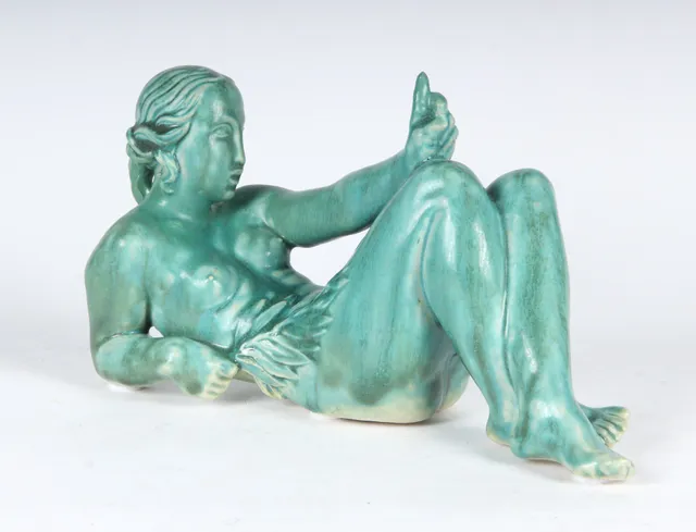 Jens Jacob Bregnø. Reclining nude woman with branch, figure of green-glazed stoneware, ca. 1930s