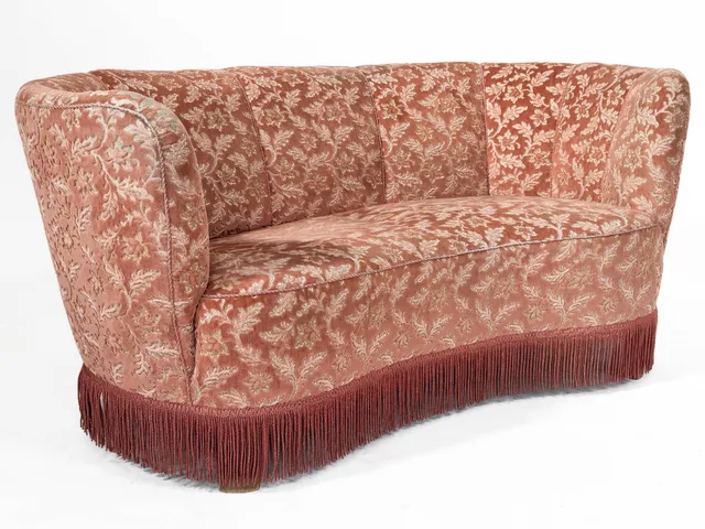 Danish furniture manufacturer. Two-seater banana sofa.