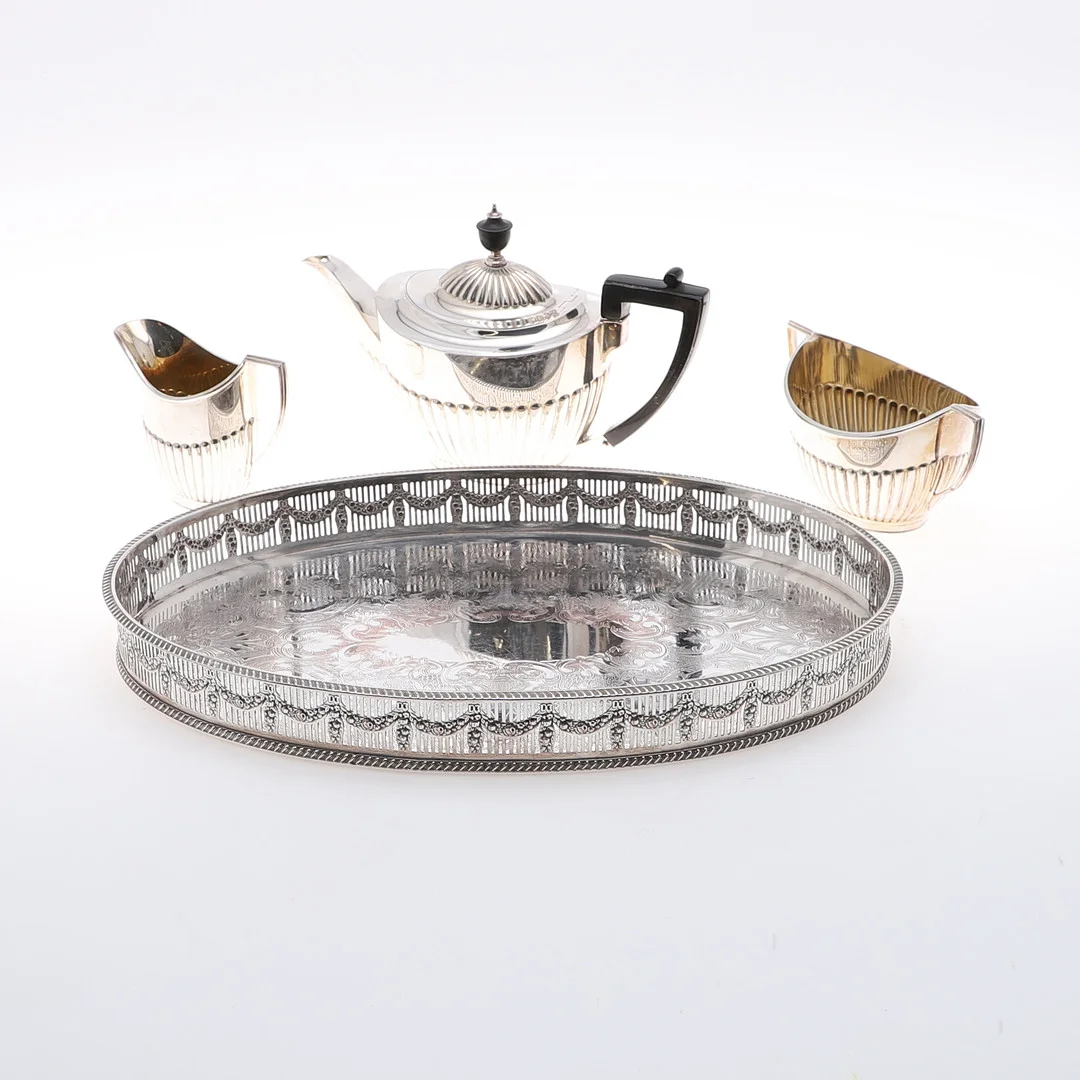 A THREE PIECE SILVER PLATED TEA SET AND A PLATED TRAY. — Silver plated — Lawrences Auctioneers
