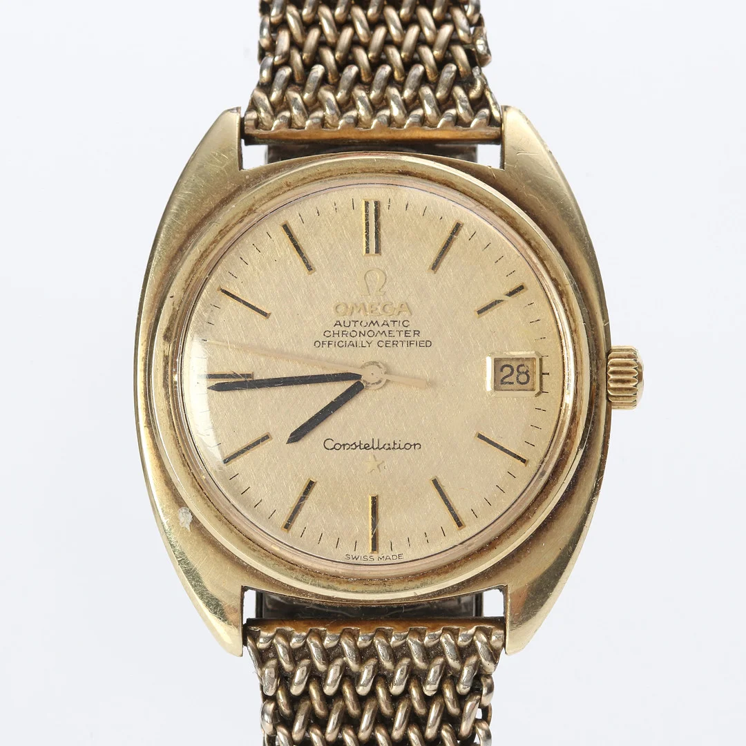 OMEGA CONSTELLATION, ARMBANDSUR. Guld på stål, automatisk. — Wristwatches — Skånes Auktionsverk
