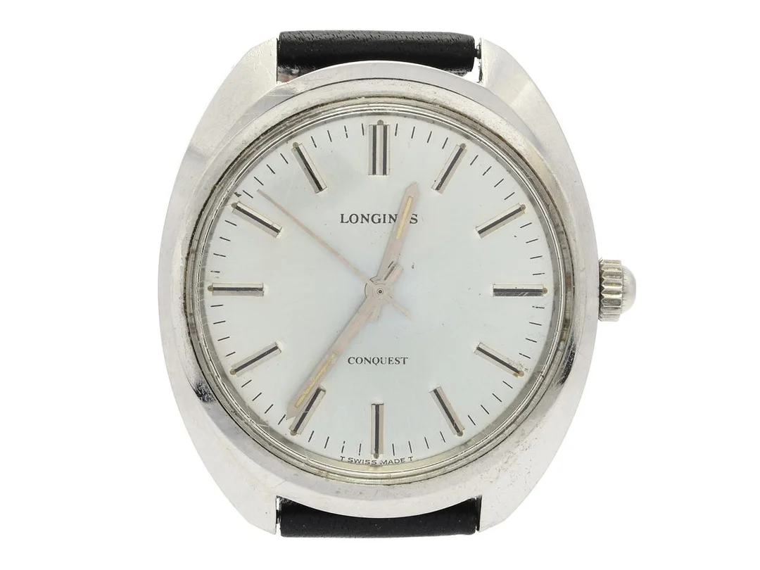LONGINES, Conquest, Cal 706, Serie nr. 52276898, Boett nr. 1500-5 / 857, herrur, 35,5 mm, stål, manuell, plexiglas, skadad urtavla, defekt, saknar krona/ställaxel, läderband, ca 1975. — Klockor/Longines — Kaplans