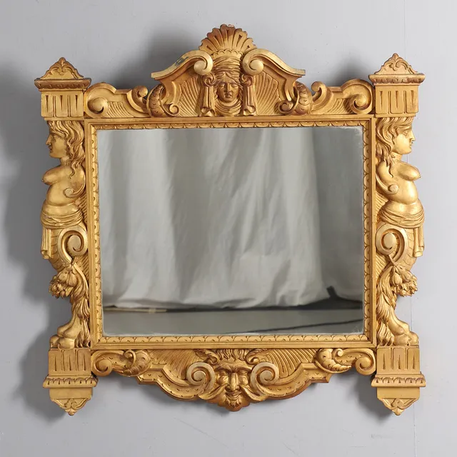 A 19TH CENTURY ITALIANATE GILTWOOD WALL MIRROR.