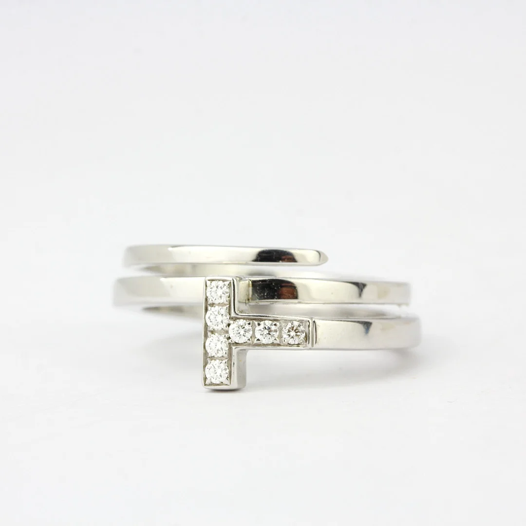 18CT WHITE GOLD TIFFANY & CO DIAMOND SET RING. — Rings — Chalkwell Auctions