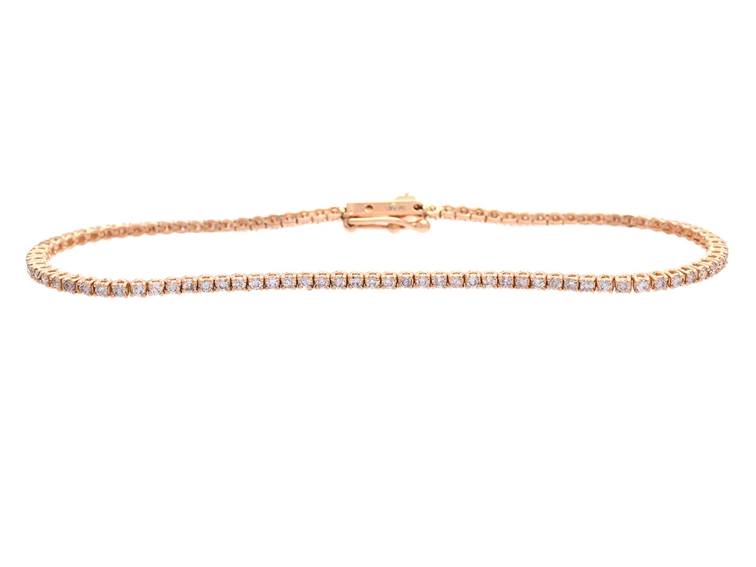 TENNISARMBAND, 14K roséguld, 98 briljantslipade diamanter ca 1,10 ctv, Faint Brown-Light Pink/P, längd 18 cm, vikt 4,9 g, flertalet diamanter med skador och nagg. — Smycken/Armband — Kaplans