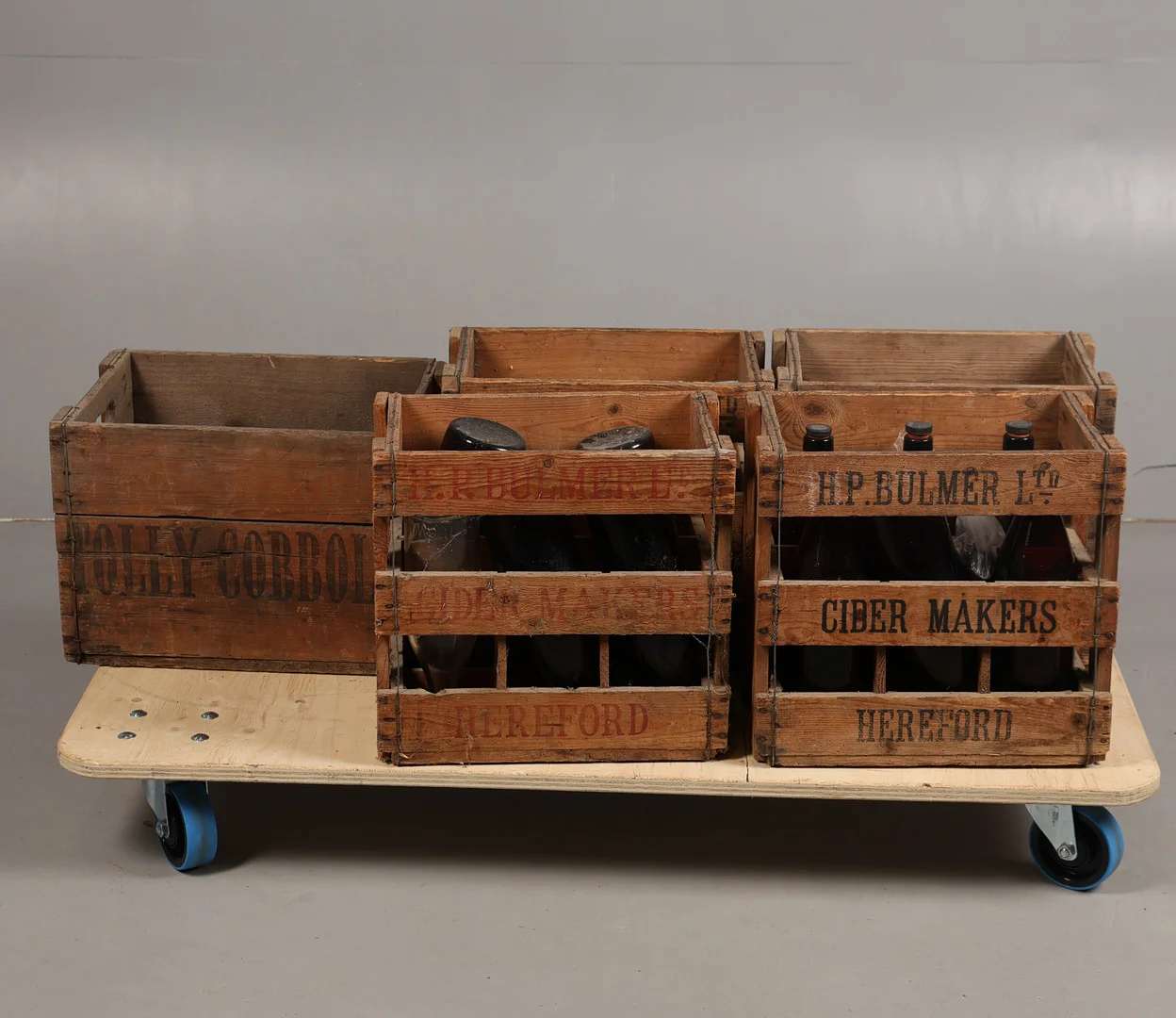 FIVE EARLY TO MID 20TH CENTURY WOODEN ADVERTINSING CRATES (5). — Advertising & Signs — Bishop & Miller