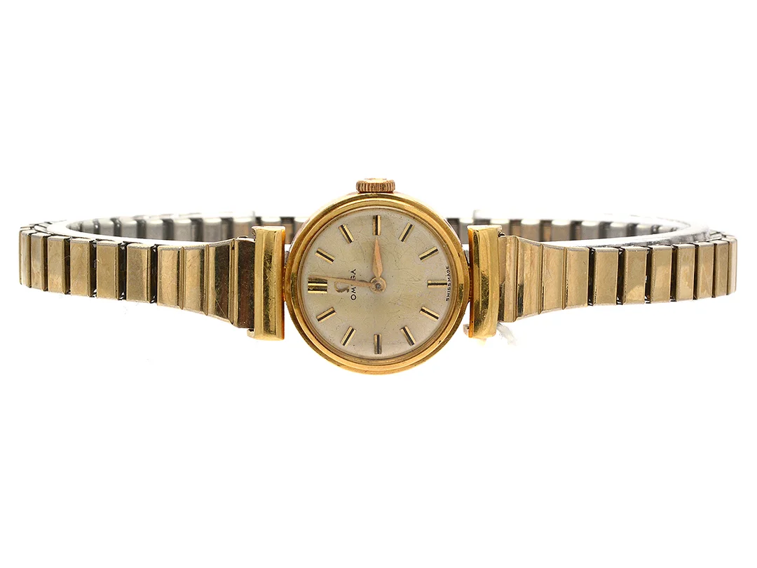 Damur 18K Omega, manuell, brv: 20,8g, reoig boett Ø10,5mm, repigt plastglas, stål flexarmband, fungerar ej — Klockor/Omega — Kaplans