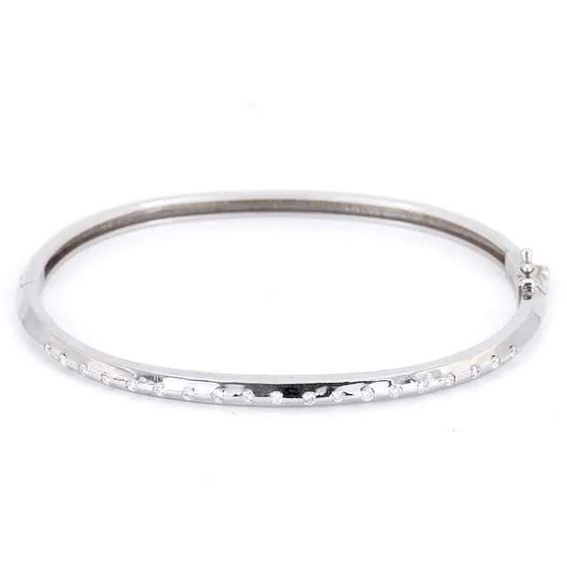 18CT DIAMOND SET BANGLE.