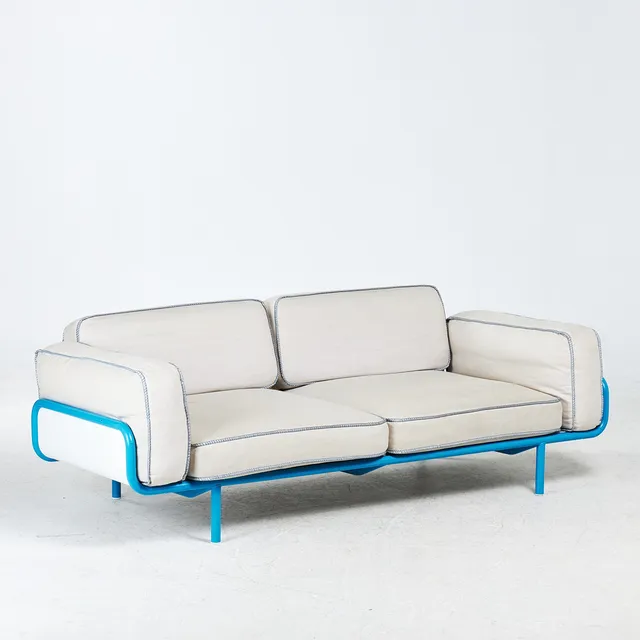 NIKE KARLSSON. SOFFA, "IKEA PS", 2012, blålackerad metallstomme, lösa textilklädda plymåer.