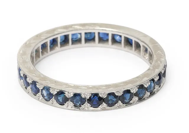 A sapphire ring set with numerous circular-cut sapphires mounted in 14k white gold. Weight app. 3 g. W. 3 mm. Size 52.5.