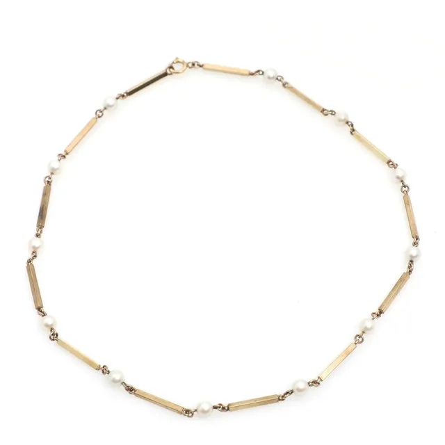 A pearl necklace set with cultured pearls, mounted in 8k gold. Weight app. 9 g. L. 42 cm.