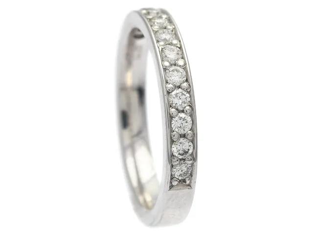 SCHALINS, alliansring, 18K vitguld, 12 briljantslipade diamanter 0,36 ctv, ca W/SI, stl 16,75 mm, vikt 4,1 g.