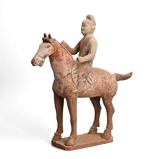 A CHINESE PAINTED POTTERY HORSE & RIDER, TANG DYNASTY (AD 618 - 906).