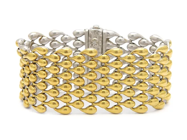 CHIMENTO, armband, 18K guld, delvis rodierat, vändbart, 2 briljantslipade diamanter ca 0,04 ctv, bredd 3 cm, längd 18 cm, vikt 58,3 g.