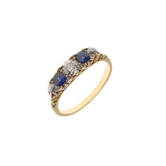 A SAPPHIRE AND DIAMOND FIVE STONE RING.