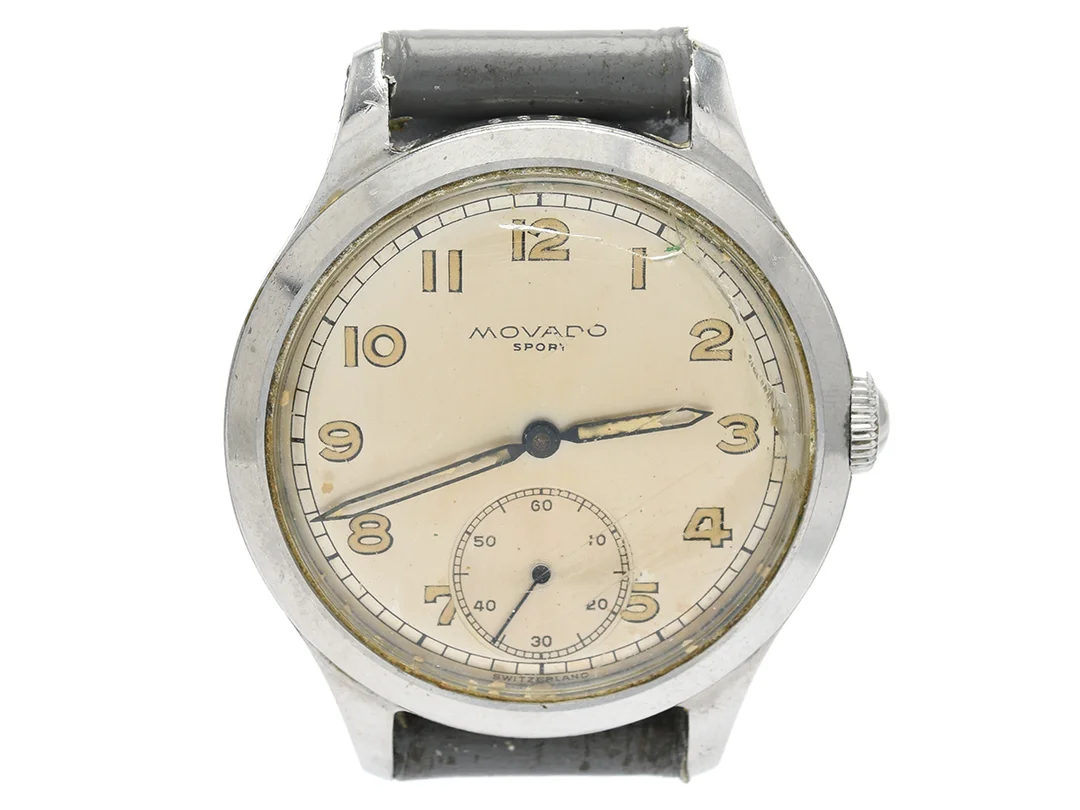 MOVADO, Sport, "Francois Borgel Case", Cal 125, Boett nr. 5589 / 1165589 / 18136, herrur, 34 mm, stål, manuell, plexiglas (skadat), liten sekundvisare, skadad urtavla/visare, ca 1950. — Klockor/Movado — Kaplans